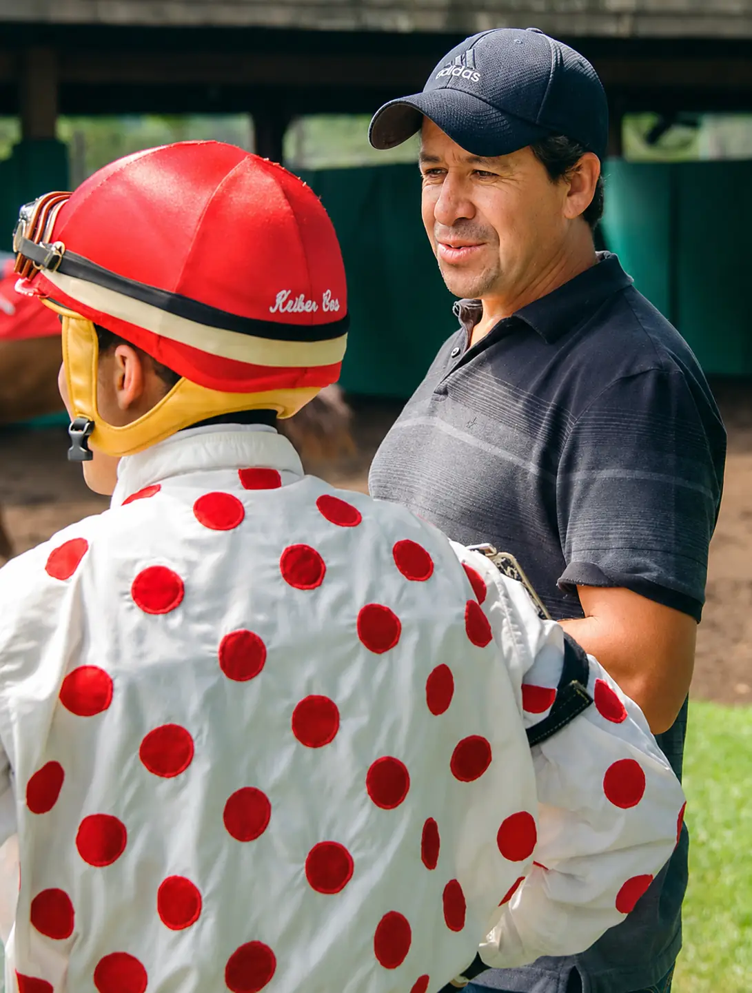 Baltazar Galvan in the winner's circle with a jockey and horse